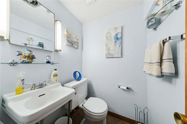 bathroom featuring sink and toilet