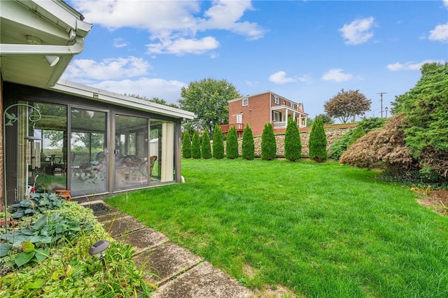 view of yard with a sunroom