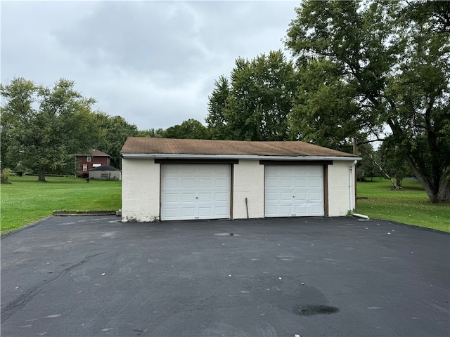 garage featuring a yard