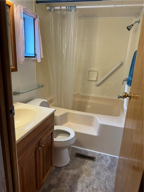 full bathroom with shower / bath combo, vanity, and toilet