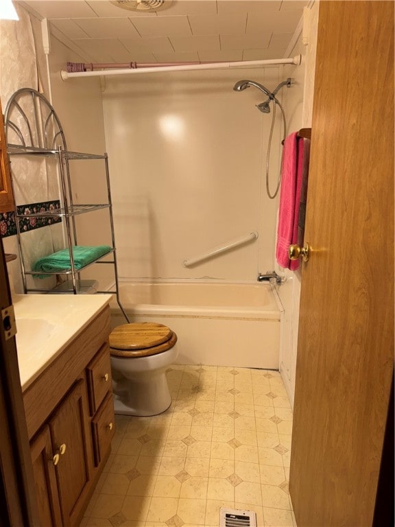 full bathroom featuring washtub / shower combination, vanity, and toilet