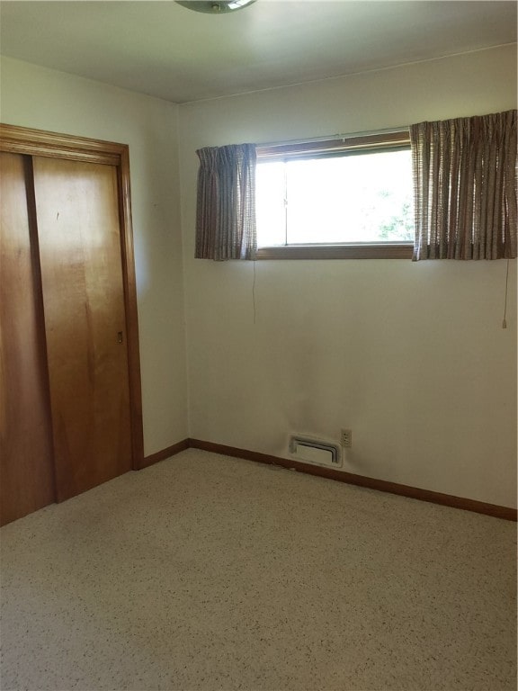 unfurnished bedroom featuring a closet