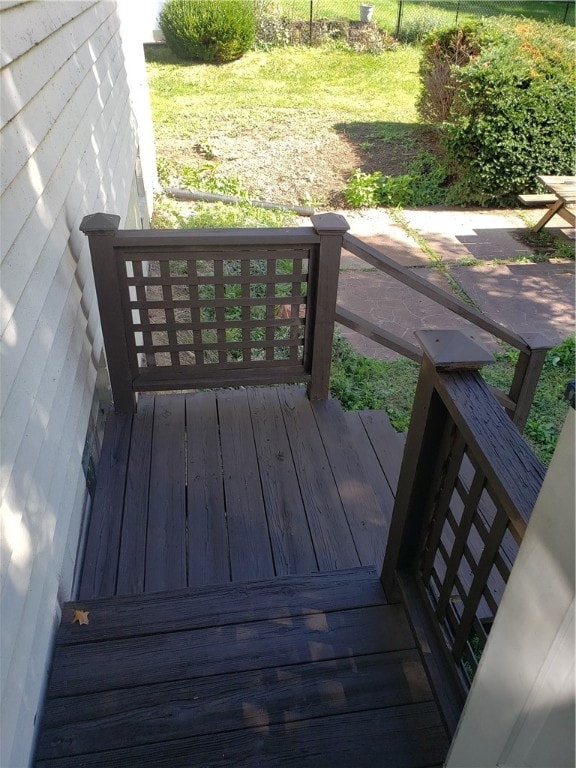 wooden terrace with a yard