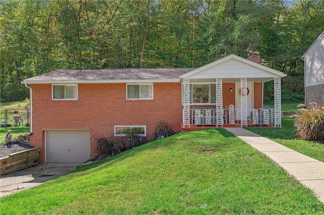 view of front of property featuring a garage, a porch, and a front lawn