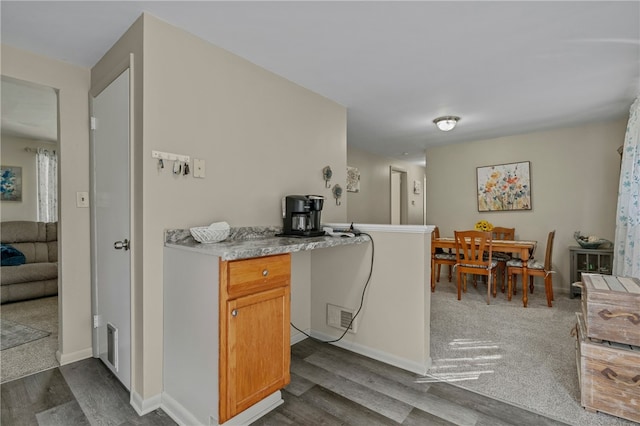 kitchen featuring dark hardwood / wood-style floors