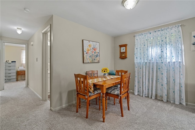 view of carpeted dining space