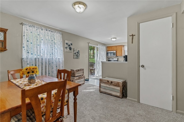 view of carpeted dining area