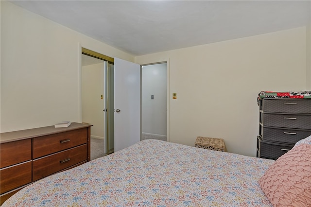 carpeted bedroom featuring a closet