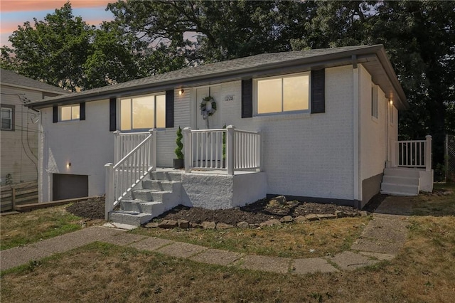 view of front of home with brick siding