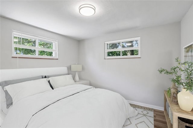 bedroom with hardwood / wood-style floors