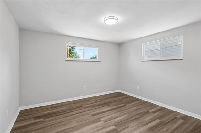 unfurnished room featuring hardwood / wood-style flooring