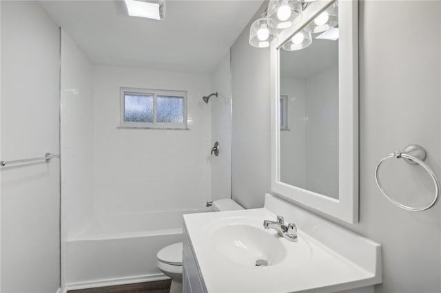 full bathroom with shower / washtub combination, vanity, and toilet