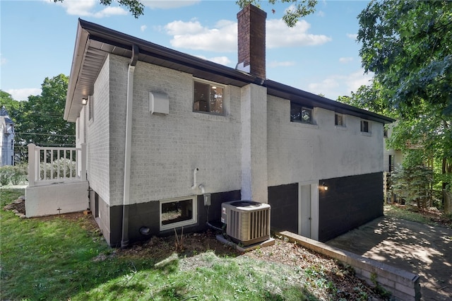 view of side of home featuring central air condition unit