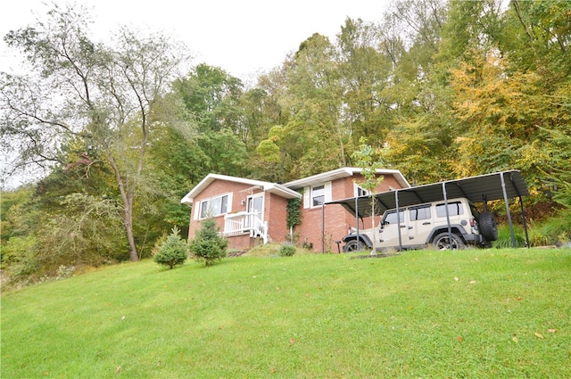 exterior space with a yard and a carport