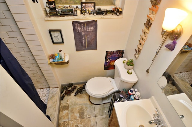 bathroom with vanity, toilet, and a shower with curtain