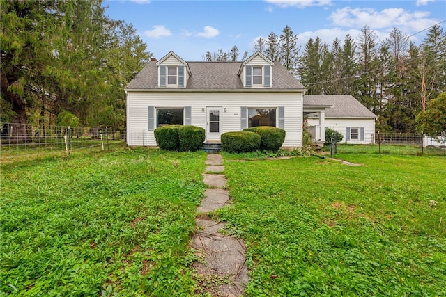 cape cod house with a front lawn