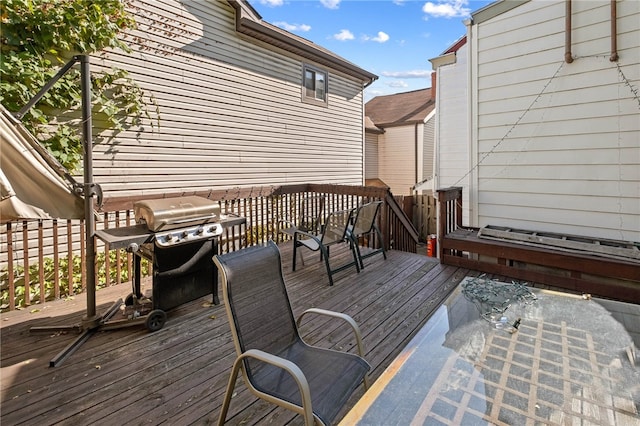 wooden terrace featuring grilling area