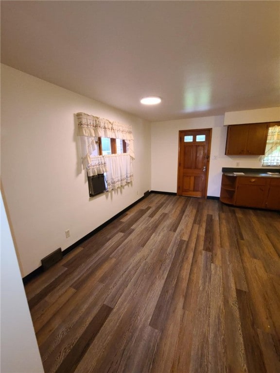 interior space featuring cooling unit, sink, and dark hardwood / wood-style flooring