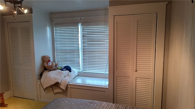 bedroom with light colored carpet