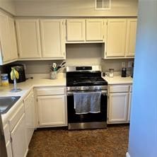 kitchen with white cabinets and stainless steel stove