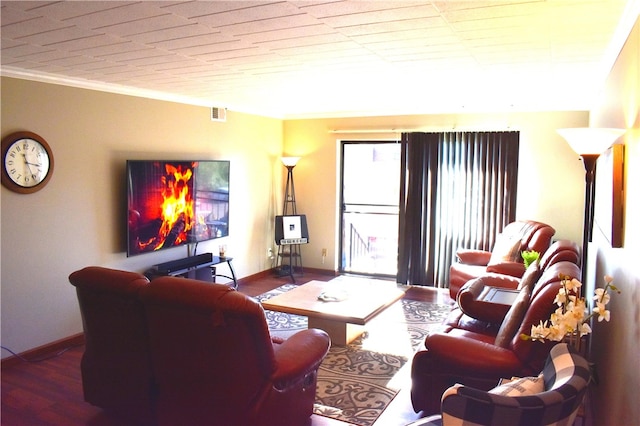 living room featuring ornamental molding and hardwood / wood-style floors