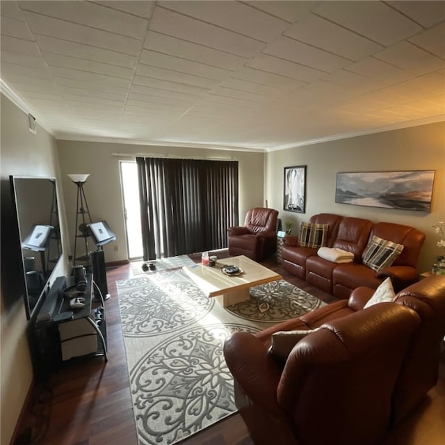 living room with ornamental molding and dark hardwood / wood-style flooring