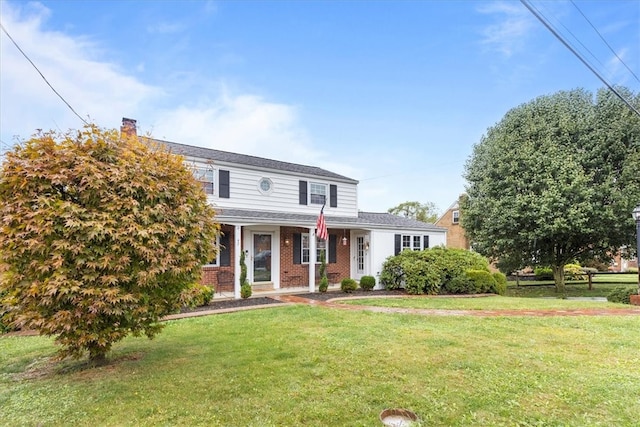 view of front of property featuring a porch and a front yard