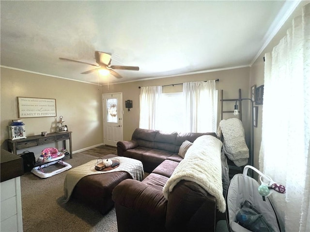 living room featuring ceiling fan and ornamental molding