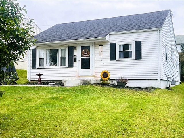 view of front of home with a front lawn