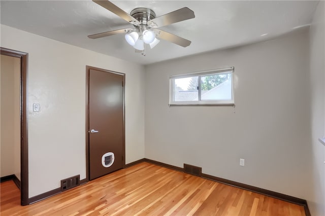 unfurnished bedroom featuring light hardwood / wood-style floors and ceiling fan