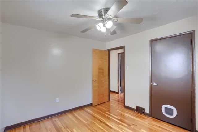 unfurnished bedroom with ceiling fan, light hardwood / wood-style floors, and a closet