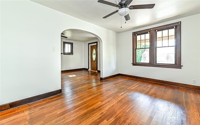 unfurnished room with ceiling fan and dark hardwood / wood-style floors