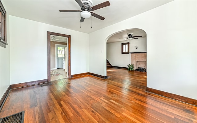 spare room featuring ceiling fan and dark hardwood / wood-style floors