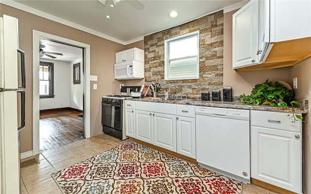 kitchen featuring white cabinets, white appliances, ceiling fan, and sink