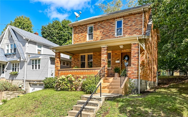 view of property with a front lawn and covered porch