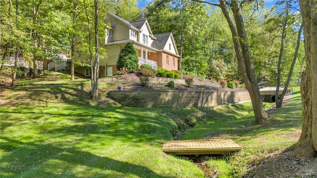 view of home's community featuring a yard