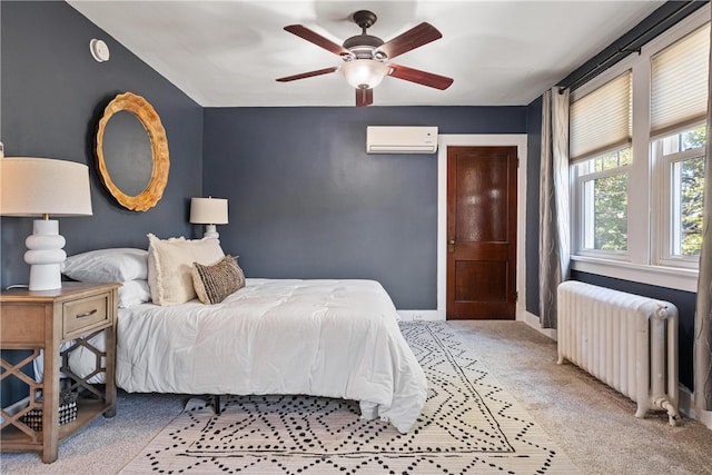 bedroom featuring light carpet, radiator, ceiling fan, and a wall mounted AC