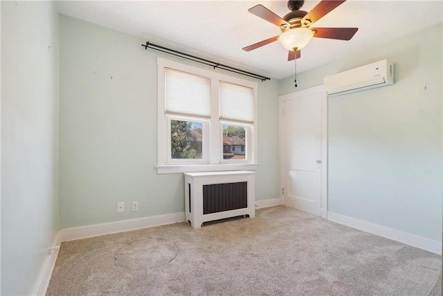 unfurnished room featuring light colored carpet, radiator, ceiling fan, and a wall unit AC