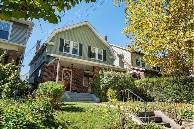 view of front of property featuring covered porch