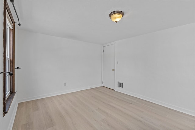 unfurnished room featuring light wood-type flooring