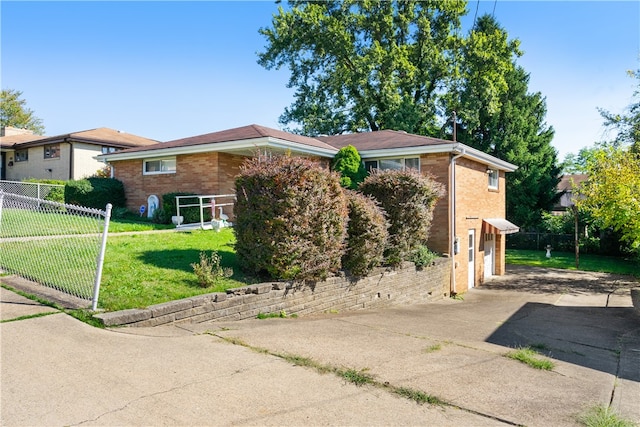 ranch-style house with a front lawn