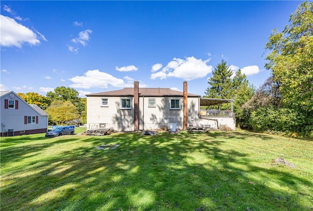 3740 Milligantown Rd, Upper Burrell, PA 15068 - rear view of property with a chimney and a lawn
