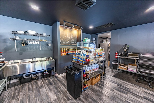 recreation room with dark hardwood / wood-style floors