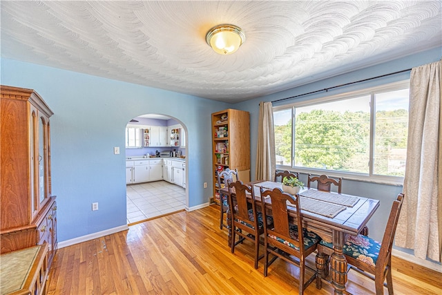 dining room with light wood-type flooring