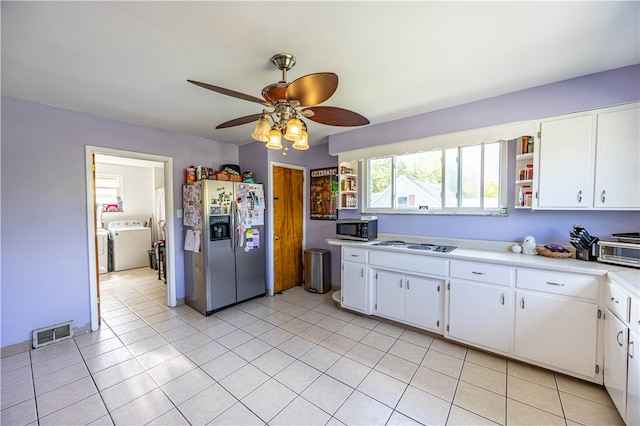 kitchen with ceiling fan, appliances with stainless steel finishes, light tile patterned floors, and white cabinetry