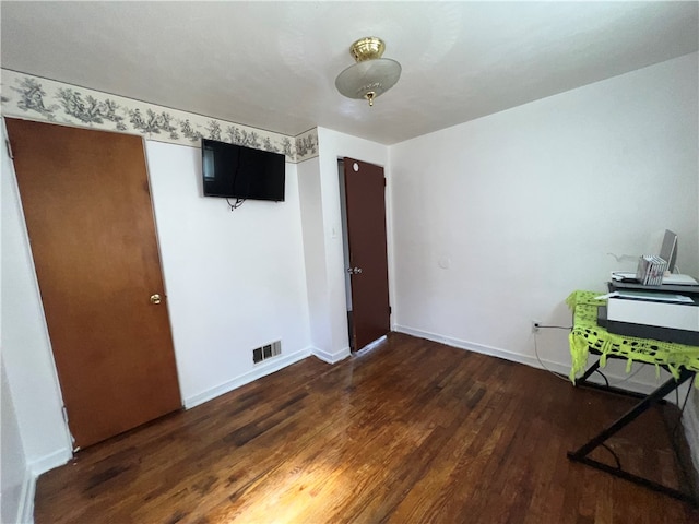 interior space with dark wood-type flooring