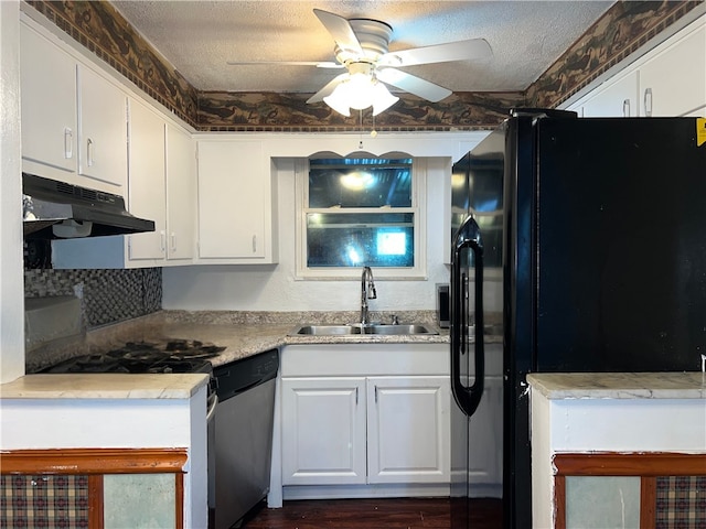 kitchen featuring white cabinetry, dishwasher, black fridge, and sink