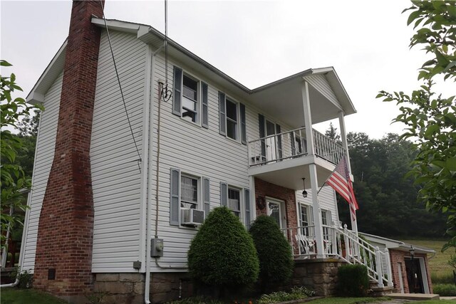 view of property exterior featuring a balcony