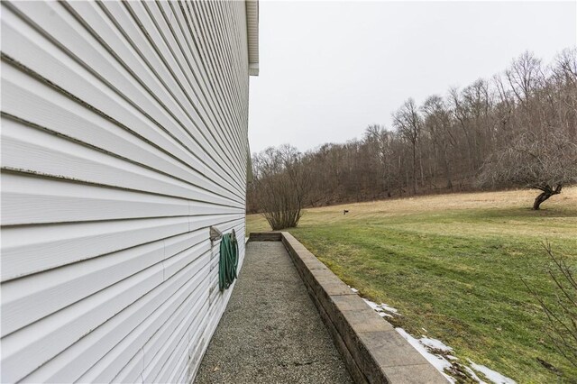 view of property exterior featuring a yard