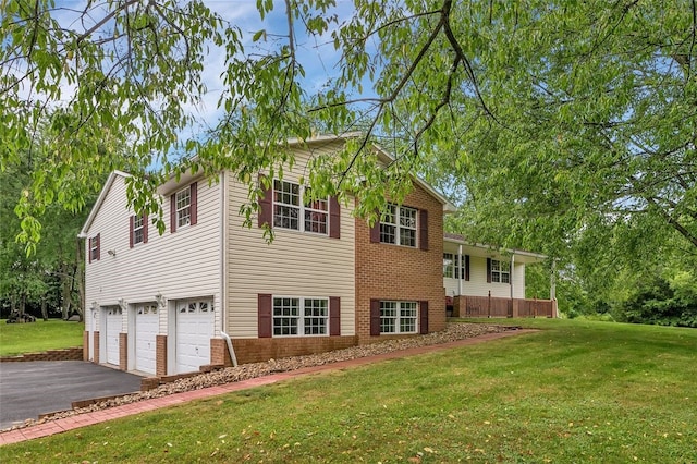 view of side of property with a garage and a yard